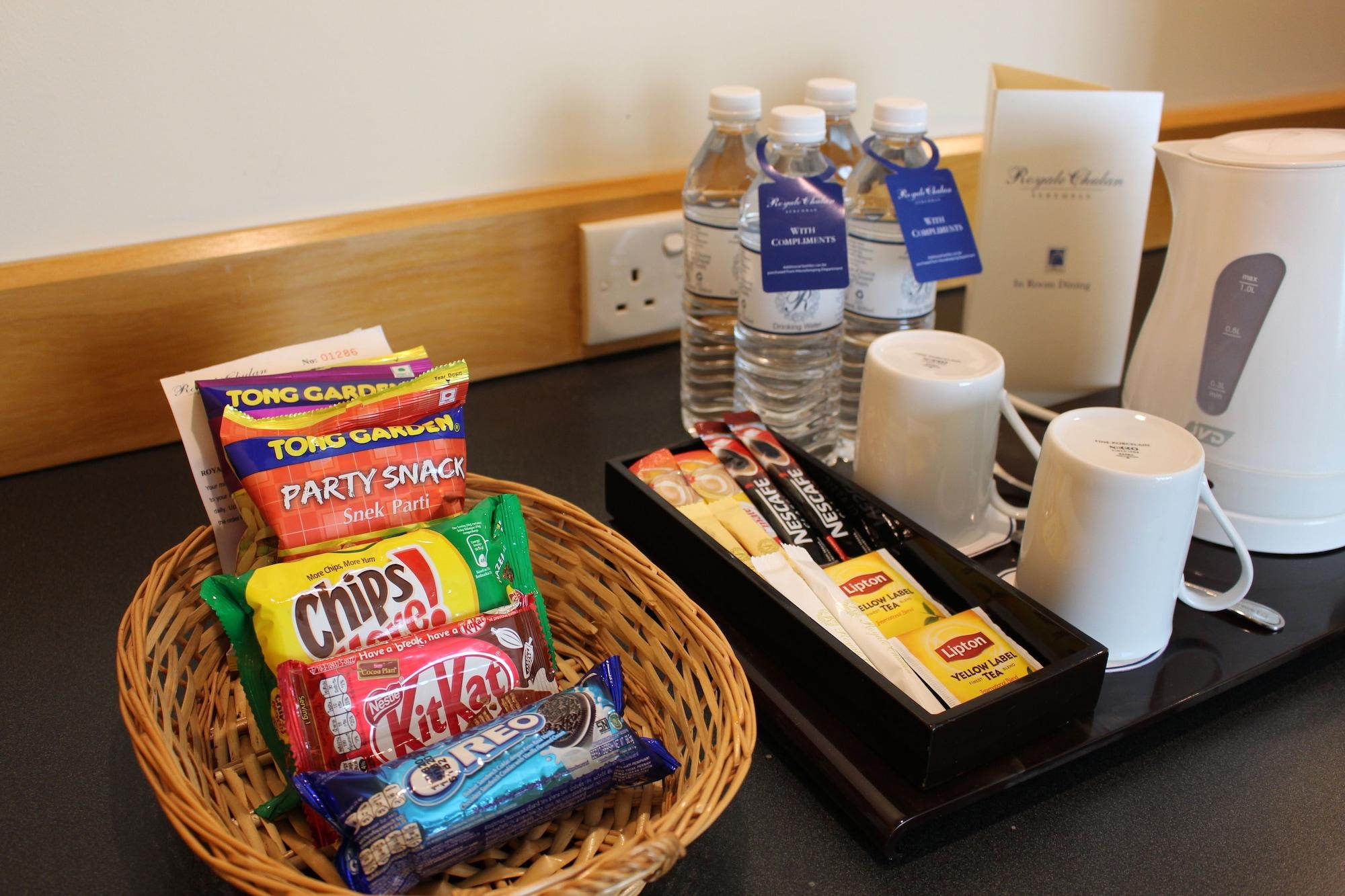 Royale Chulan Серембан Екстериор снимка A selection of snacks and bottled water in a hotel room